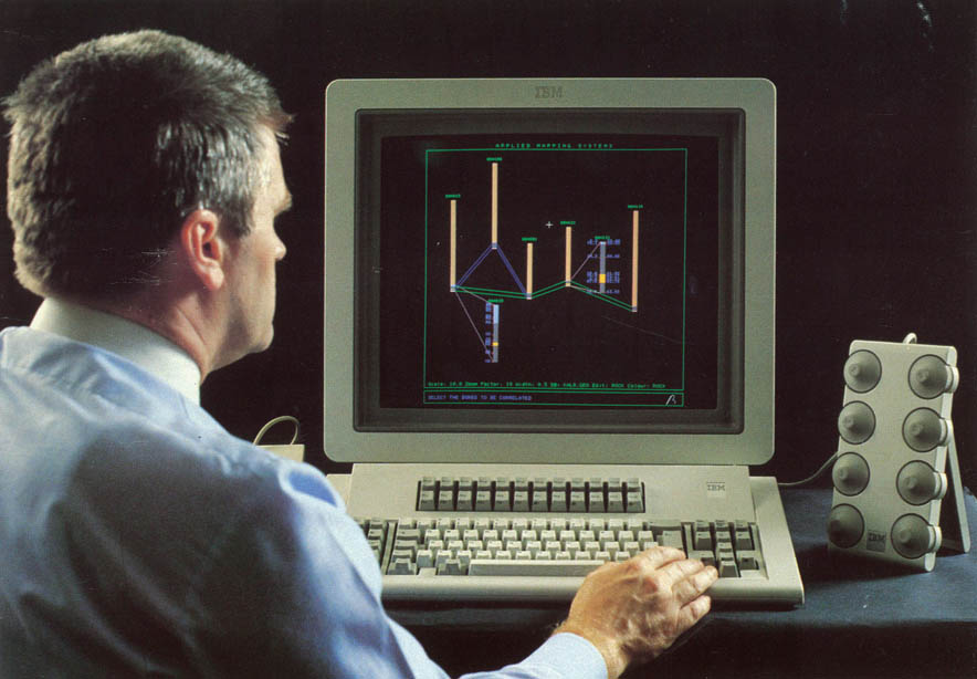 Bob Johnson demonstrating visual mining graphics on an IBM computer.