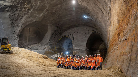 PSM team members in the underground cavern of Victoria Cross Station, within the Sydney Metro Project.