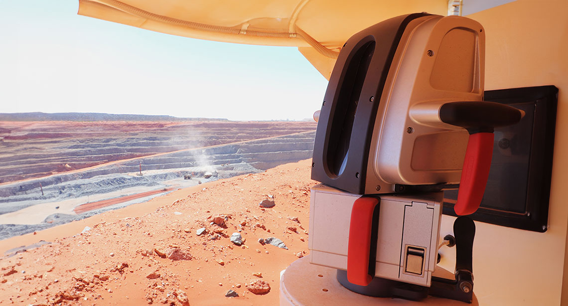 UR3 scanner overlooking a vast, red, sandy pit