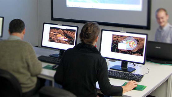 People learning Maptek software in a classroom environment.